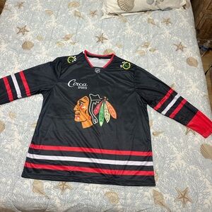 Blackhawks hockey shirt.